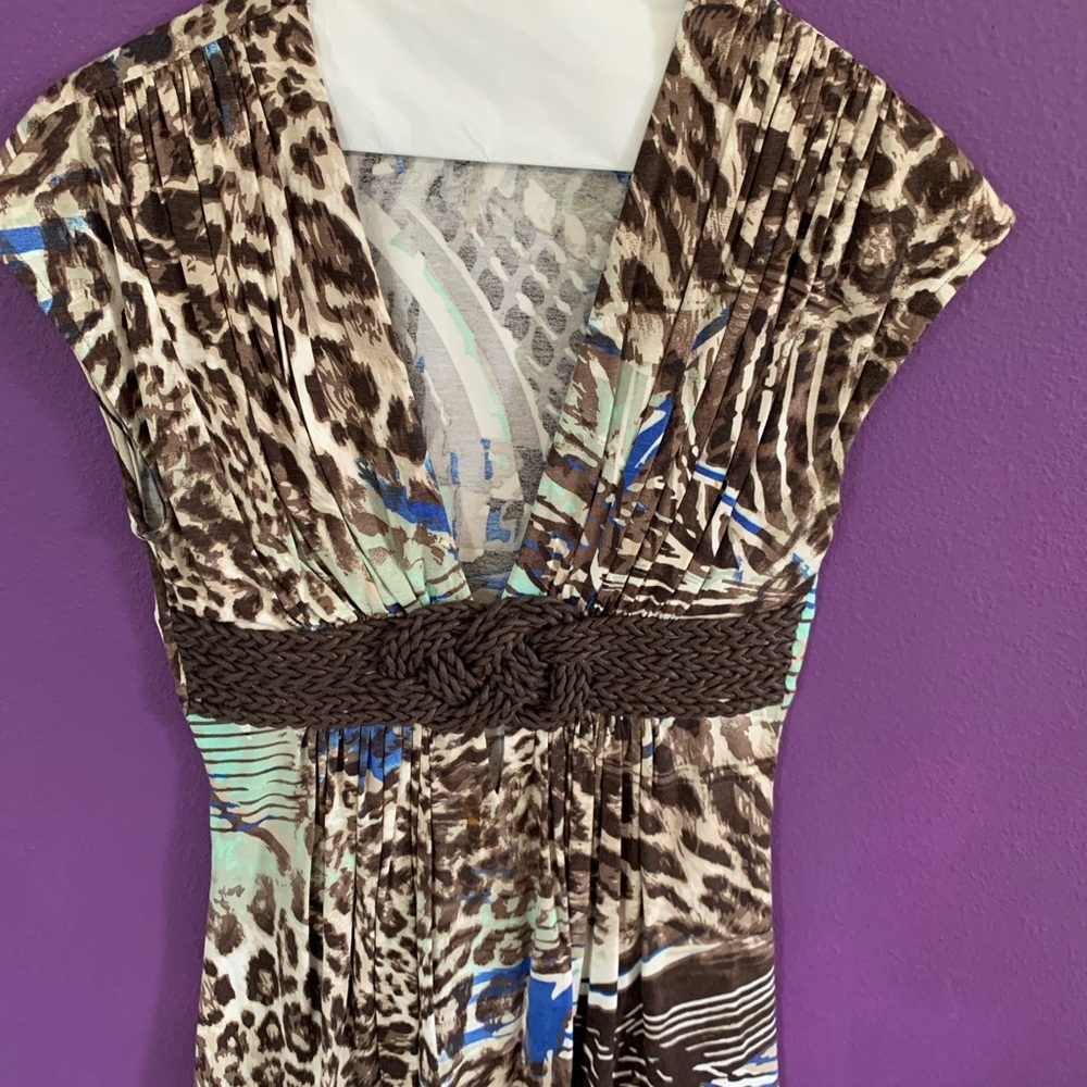Flattering SKY top with intricate belt design